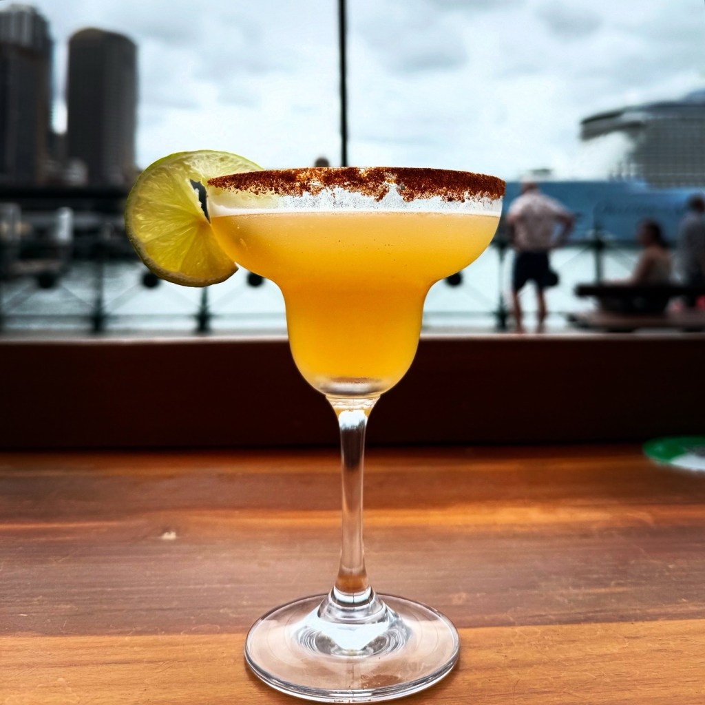 Spicy Margarita with Sydney Port in the background.