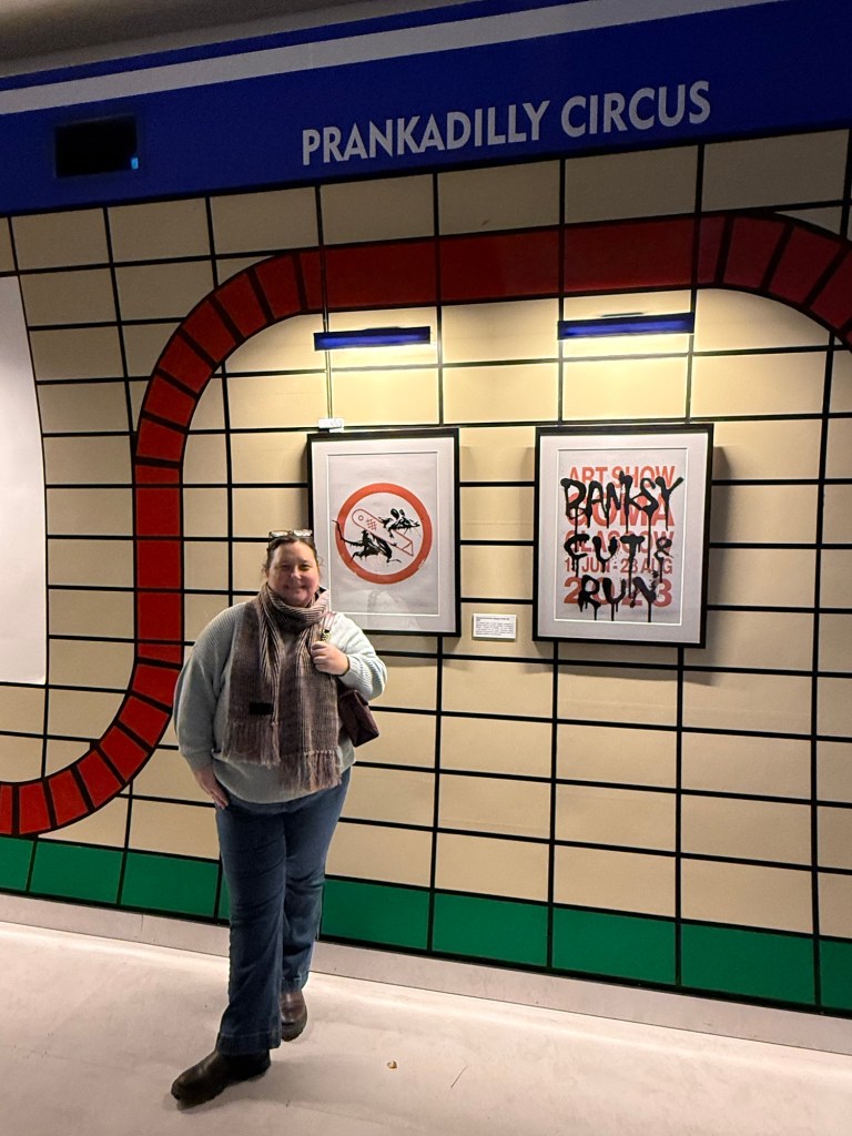 LOACM at the Banksy Experience in London. Mock up of a tube station with Banksy artwork on the wall